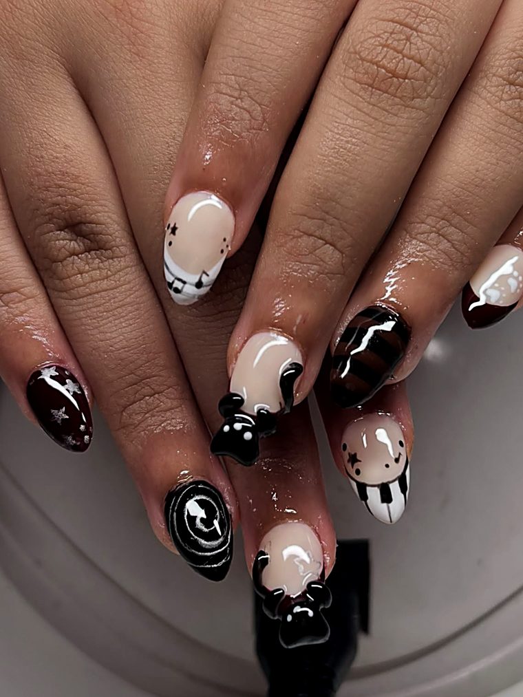 Pink and white nails with dotted tips and 3D flowers