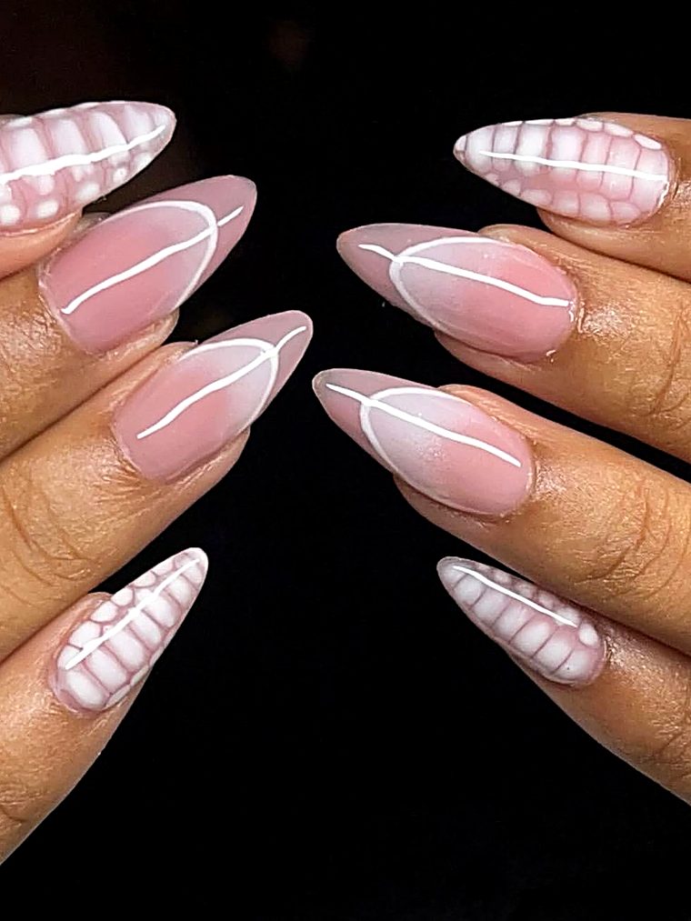 Pink French tips with white swirls and tiny dots