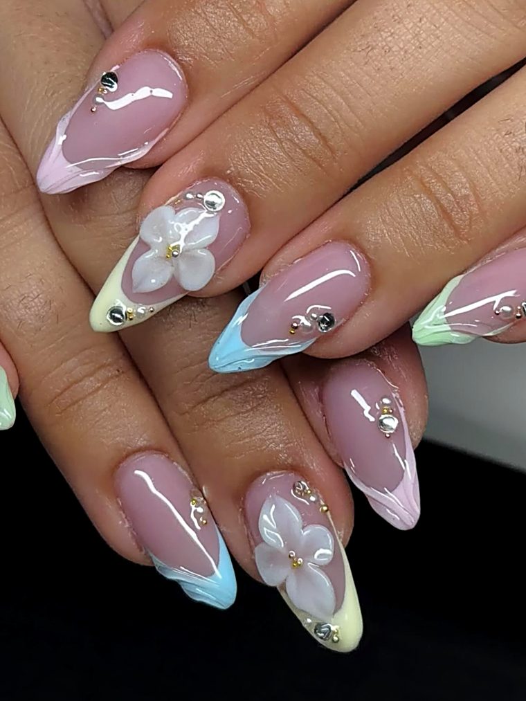 Milky nails with blue and yellow 3D flowers and crystals